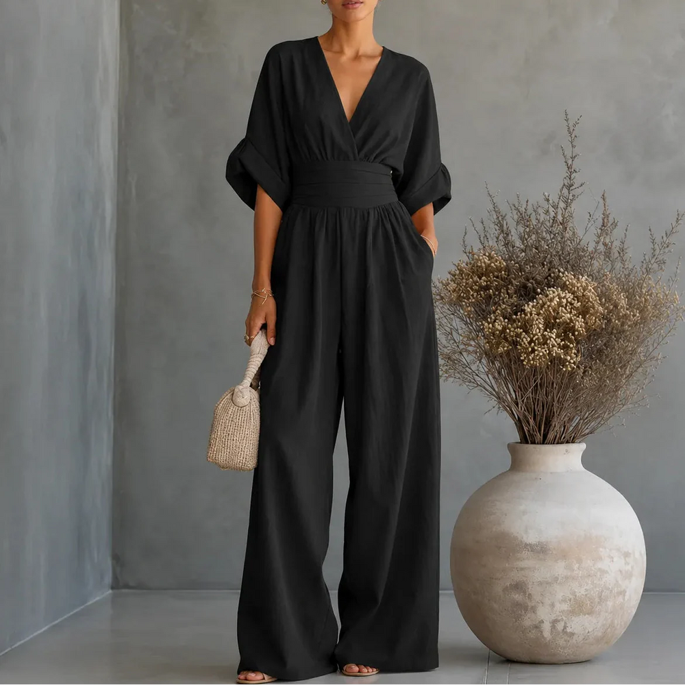 Soléra – Wide Leg V Neck Jumpsuit with Pleated Waist Sash