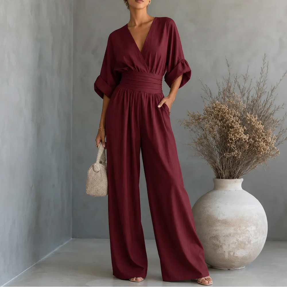 Soléra – Wide Leg V Neck Jumpsuit with Pleated Waist Sash