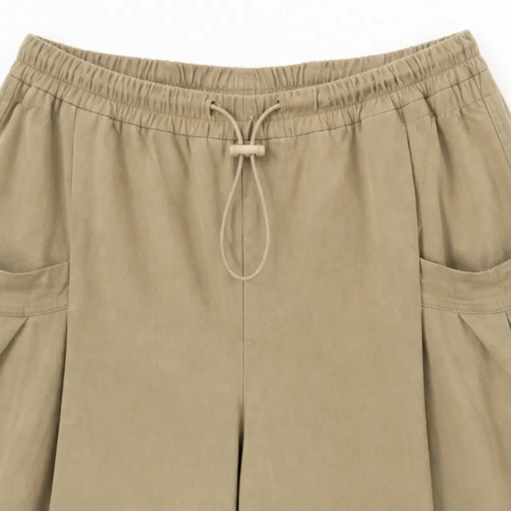 Lorenza – Pleated Wide-Leg Lantern Trousers with Drawstring Waist and Deep Pockets
