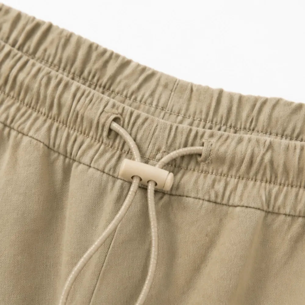 Lorenza – Pleated Wide-Leg Lantern Trousers with Drawstring Waist and Deep Pockets
