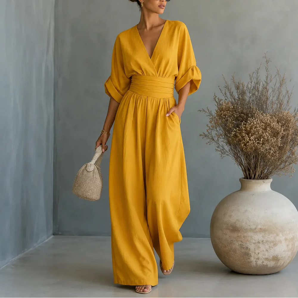 Soléra – Wide Leg V Neck Jumpsuit with Pleated Waist Sash