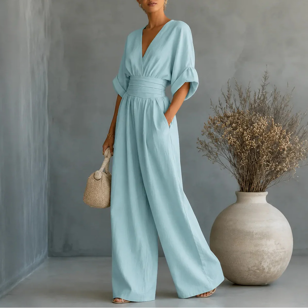 Soléra – Wide Leg V Neck Jumpsuit with Pleated Waist Sash