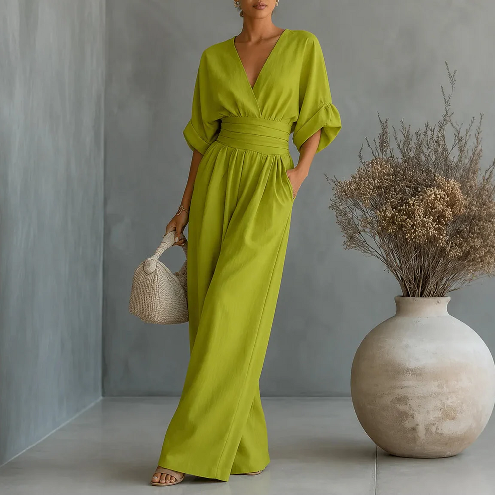 Soléra – Wide Leg V Neck Jumpsuit with Pleated Waist Sash