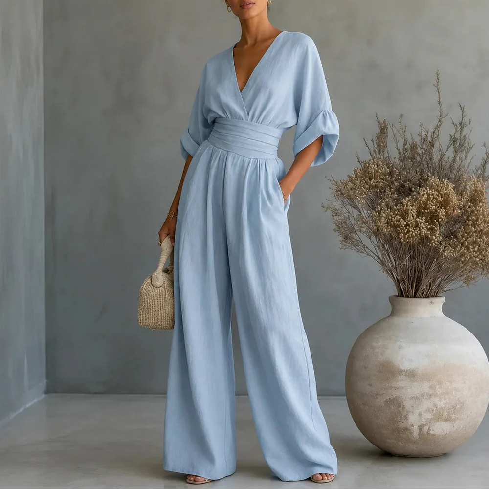 Soléra – Wide Leg V Neck Jumpsuit with Pleated Waist Sash